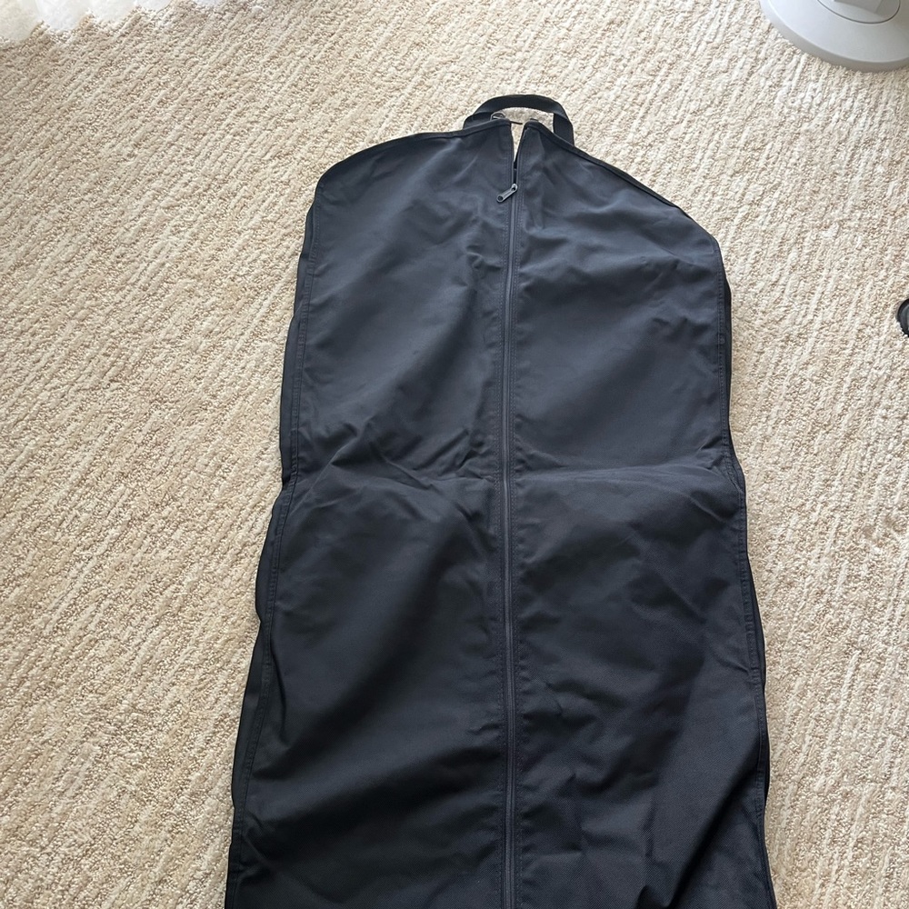 zippered garment bag.  multiple pockets and existing hangar which clamps at top